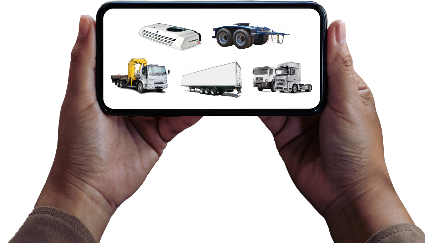 Mãos segurando um celular com imagens de caminhões, carretas e unidade de ar condicionado